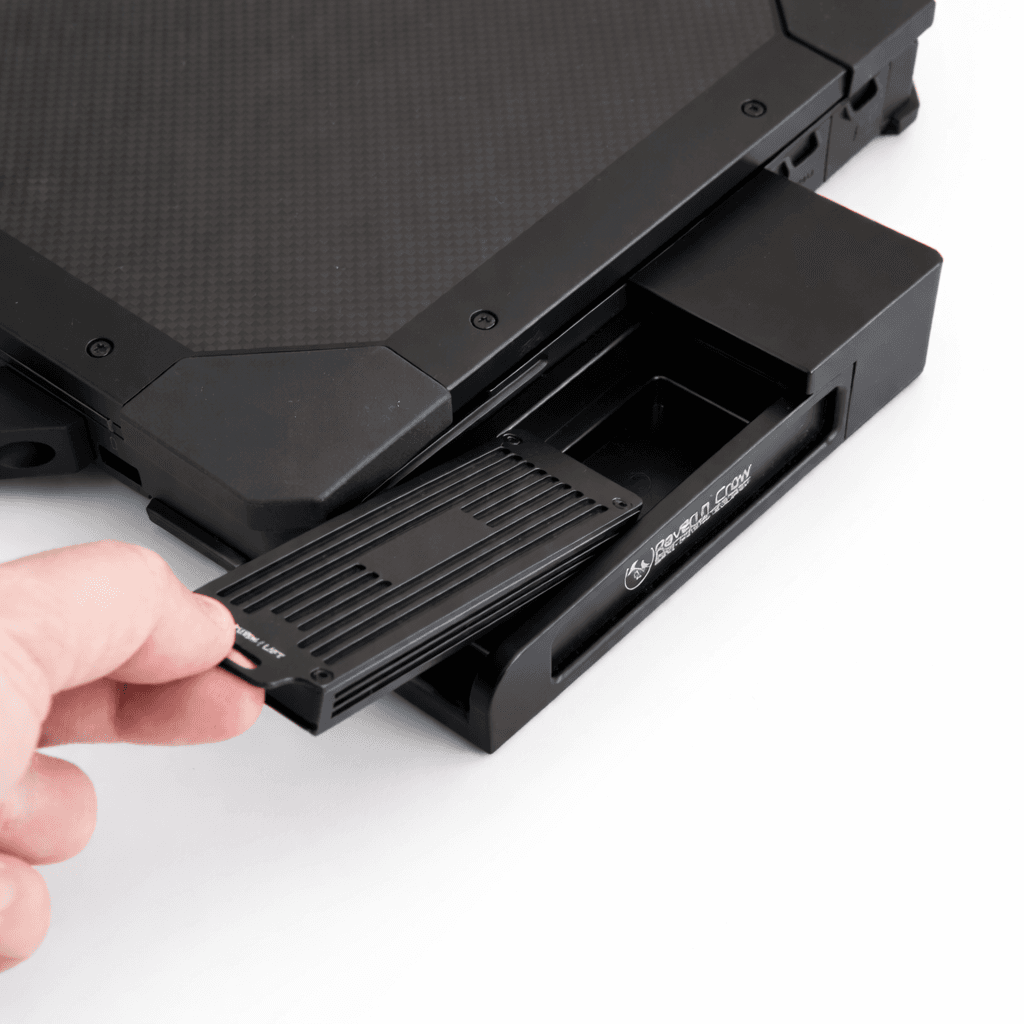 Dell quick swap hard disk — close-up of SSD being removed by hand